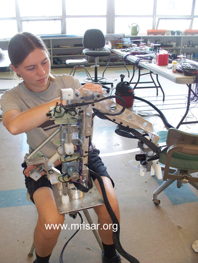 MRISAR's Team member Autumn Siegel fabricating a Robotic Arm exhibit.