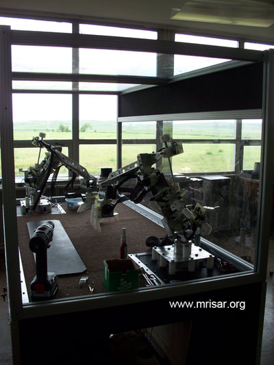 MRISAR's R&D Team members fabricating  Dual Combo Robotic Arm exhibits.