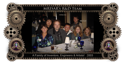 MRISAR's R&D Family Team Members; from left; Victoria Lee Croasdell, John Adrian Siegel, Autumn Siegel, Michael Cook and Aurora Siegel, 2003. The team is shown here at a dinner party hosted by IEEE RO-MAN 2003; International Workshop on Robot and Human Interactive Communication, during convention in San Francisco, where they presented their philanthropic work in rehabilitation robotics for the disabled. They met other robotic inventors from all over the world there. Victoria’s youngest son Michael, who also works for MRISAR and is an inventor, joined them. The conference was sponsored by: IEEE Industrial Electronics Society, Robotics Society of Japan, Hosei University, Hosei University Research Institute, California, New Technology Foundation. Technical Sponsors: IEEE Robotics and Automation Society, Virtual Reality Society of Japan. With Additional Support from Faculty and Staff of: Stanford University, VA Palo Alto Health Care System, Immersion Corporation, Intuitive Surgical Inc.