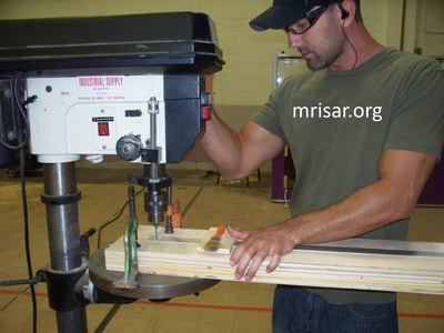 MRISAR's Team member Michael Cook fabricating Robotic exhibits.