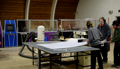 MRISAR Team members Autumn Siegel, John Siegel and Aurora Siegel fabricating Robotic exhibits.