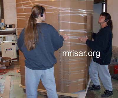MRISAR Team members Victoria Croasdell Siegel and Autumn Siegel, prepping for shipping our Robotic Arm exhibits.