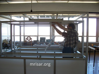 MRISAR's team fabricating Dual Challenge the Robot exhibits.