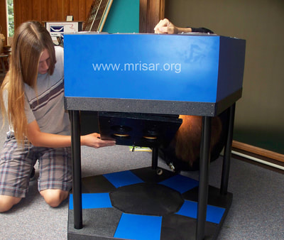 Interactive Science Exhibit; Super Photonic Pentiductor Exhibit, designed and fabricated by MRISAR. We have been making them since 1993. MRISAR's team members Autumn and John Siegel, making a Super Photonic Pentiductor Exhibit. 