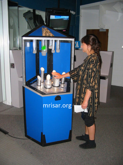 Science Exhibit; MRISAR's team member Victoria testing a Photonic Spectrum exhibit. They have been making them since 2001.