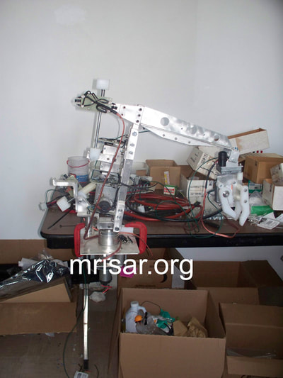 MRISAR's Team fabricating parts for our interactive regular and teleoperated exhibit grade 3 and 5 finger robot arms. We sell them as kits or installed into our standard cases or in custom ordered cases. We have been making exhibit grade robotics since 1991.