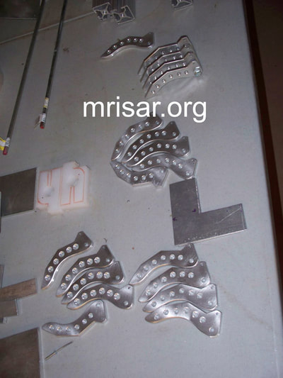 MRISAR's Team fabricating parts for our interactive regular and teleoperated exhibit grade 3 and 5 finger robot arms. We sell them as kits or installed into our standard cases or in custom ordered cases. We have been making exhibit grade robotics since 1991.