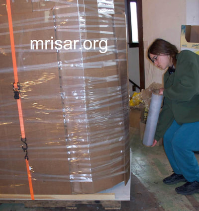 MRISAR Team member Aurora Siegel, prepping for shipping our Robotic Arm exhibits.