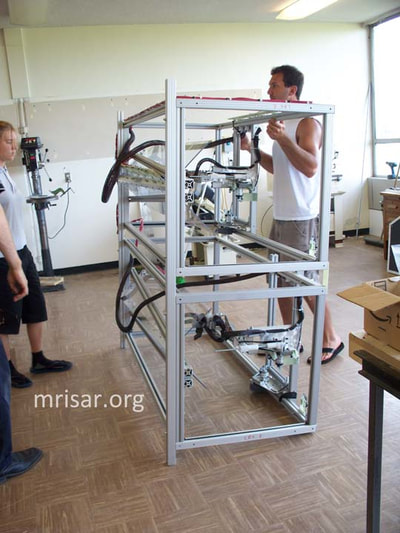 MRISAR's team breaking down Dual Challenge the Robot exhibits for ease of shipping.