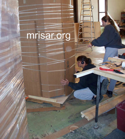 MRISAR Team members Victoria Croasdell Siegel and Autumn Siegel, prepping for shipping our Robotic Arm exhibits.