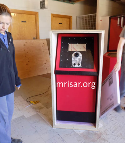 Interactive Science Exhibit; Kaleidoscopic Viewer exhibit, designed and fabricated by MRISAR. Seen here is MRISAR Team member Autumn Siegel, who began her apprenticeship in science, art and robotic exhibit creation as a preschooler. 