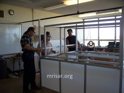 MRISAR's team fabricating Dual Challenge the Robot exhibits.