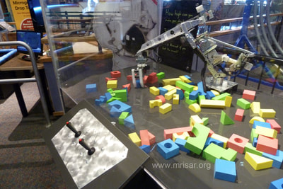 MRISAR's 3 Finger Robot Arm Kit incorporated into a case at Science North, which is an interactive science museum in Greater Sudbury, Ontario, Canada. 