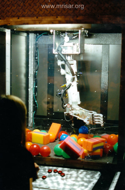 MRISAR's R&D Team member Autumn with our prototype Top Mounted Robot Arm Simulator in 2001.