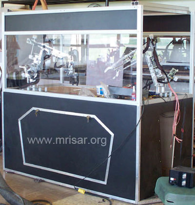 MRISAR's R&D Team members fabricating a Dual Combo Robotic Arm exhibit.
