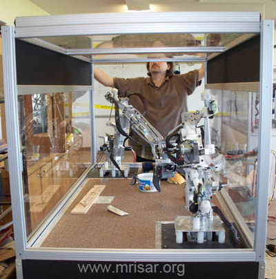 MRISAR's R&D Team member John fabricating a Dual Combo Robotic Arm exhibit.