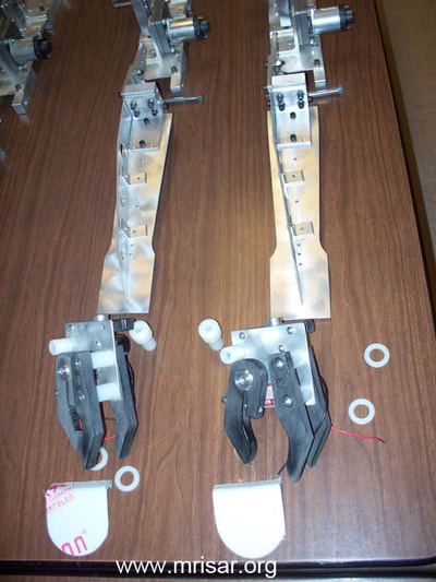 MRISAR's R&D Team members fabricating  Dual Combo Robotic Arm exhibits.