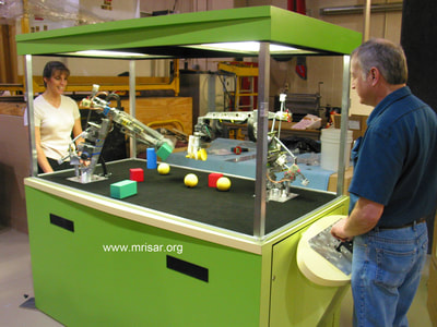Example of a customer who built their own case and placed MRISAR's 3-5 Finger Dual Robot Arm Kit into it. Image taken at EAA Airventure, Wisconsin.