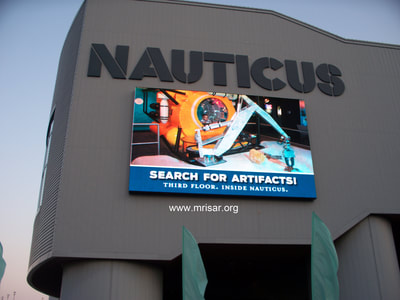 MRISAR’s Giant Robot Arm (9’.5”) incorporated into a life sized sub at Nauticas! Nauticus is a maritime-themed science center and museum located in Norfolk, Virginia, also known as the National Maritime Center.