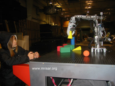 MRISAR's team  installing two of our 3 Finger Robot Arm Kits that were incorporated into “Robots; the Interactive Exhibition”. During its USA tour our part of the exhibition was hailed as being exceedingly popular. It won the THEA Award!
