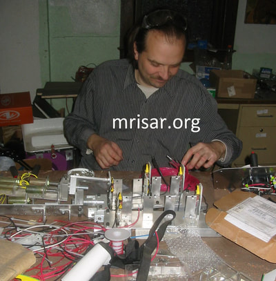 MRISAR's Custom Challenge the Robot Exhibit Kit! We fabricated this in 2004 for Sultan Bin Abdulaziz's Science Center. Seen here is MRISAR team member John Siegel during the design and fabrication process.