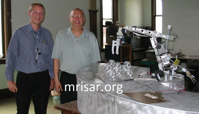 MRISAR's Custom Challenge the Robot Exhibit Kit! We fabricated this in 2004 for Sultan Bin Abdulaziz's Science Center. Seen here are two European representatives for the Sultan when they came over to see the robotic kit prior to shipping it! 